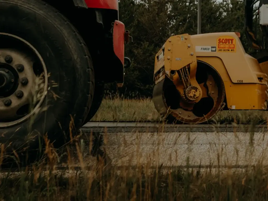 Cold mix asphalt repair hero image showing temporary asphalt patching service provided by Scott Construction.